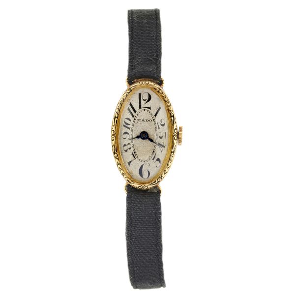 



MADO LADY'S WATCH IN YELLOW GOLD 