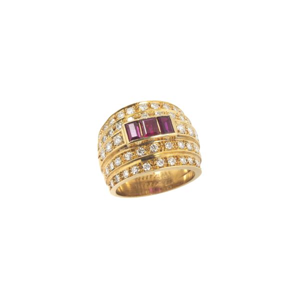 



RUBY AND DIAMOND WIDE BAND RING IN 18KT YELLOW GOLD