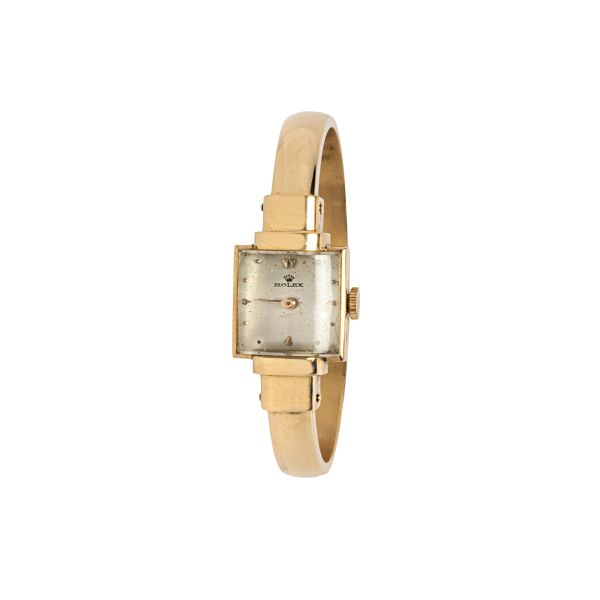 Rolex - 



ROLEX YELLOW GOLD LADY'S WATCH WITH A HANDCUFF BRACELET