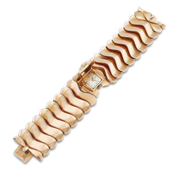 WIDE BAND BRACELET WITH A RETRACTABLE WATCH IN 18KT ROSE GOLD