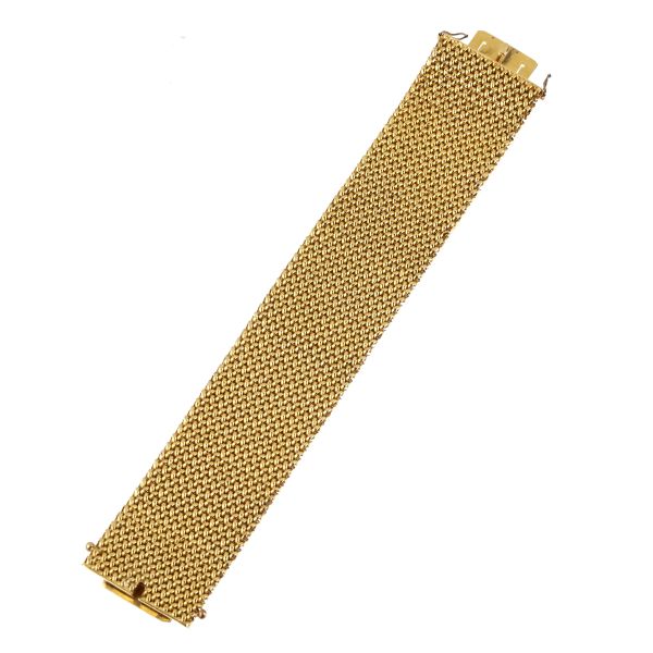



WIDE BAND BRACELET IN 18KT YELLOW GOLD