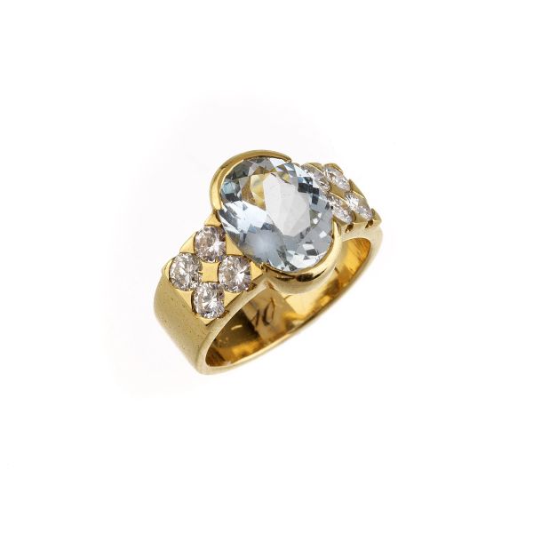AQUAMARINE AND DIAMOND BAND RING IN 18KT YELLOW GOLD
