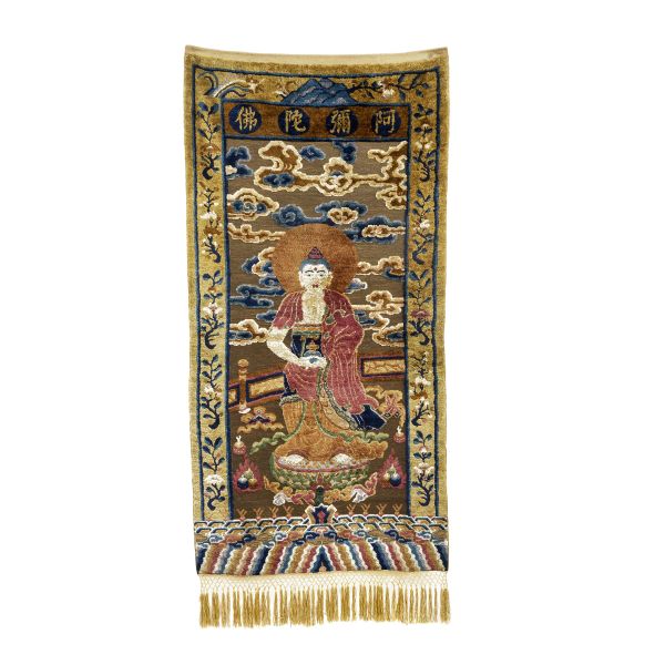 



A WOOLEN CARPET WITH AMITABHA, CHINA, LATE QING DYNASTY