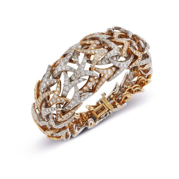 



DAVID WEBB DIAMOND WIDE BAND BRACELET IN 18KT YELLOW GOLD AND PLATINUM 