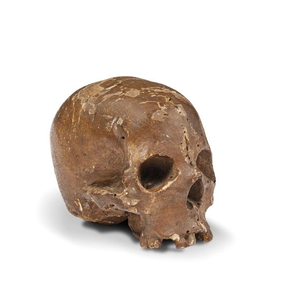 Northern Italian, 18th century, A skull, painted wood, h. 10,5 cm