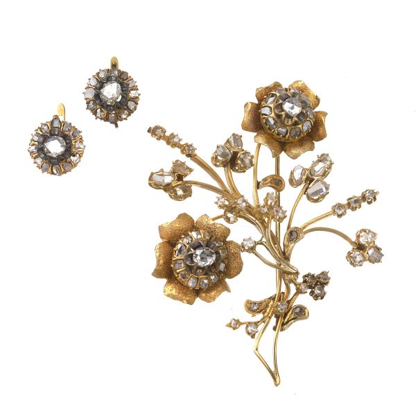 



DIAMOND FLORAL DEMI PARURE IN GOLD AND SILVER 