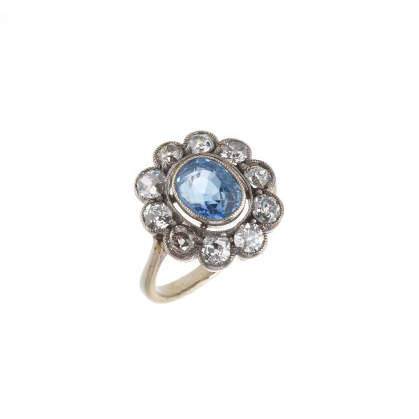 SYNTHETIC SAPPHIRE AND DIAMOND FLOWER SHAPED RING IN SILVER AND GOLD