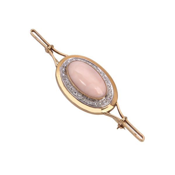 



ROSE CORAL AND DIAMOND BROOCH IN 18KT TWO TONE GOLD