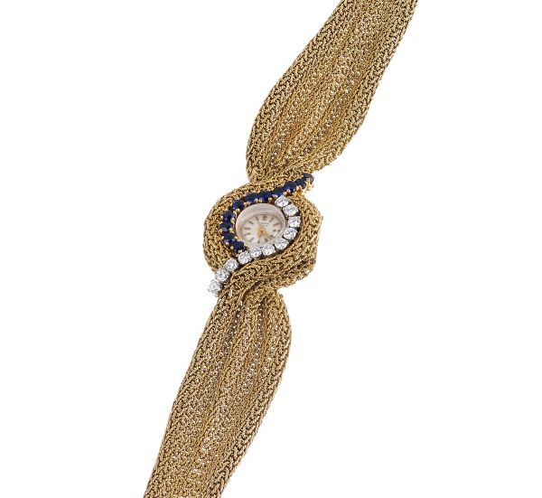 



UNIVERSAL GENEVE WATCH/BRACELET IN YELLOW GOLD