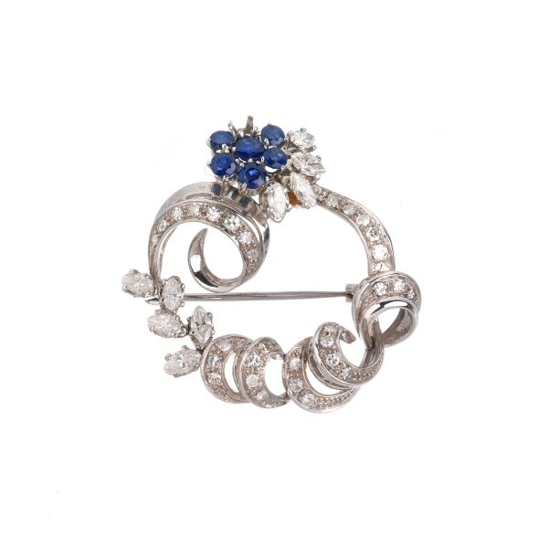 



SAPPHIRE AND DIAMOND FLOWERING BRANCH BROOCH IN 18KT WHITE GOLD 