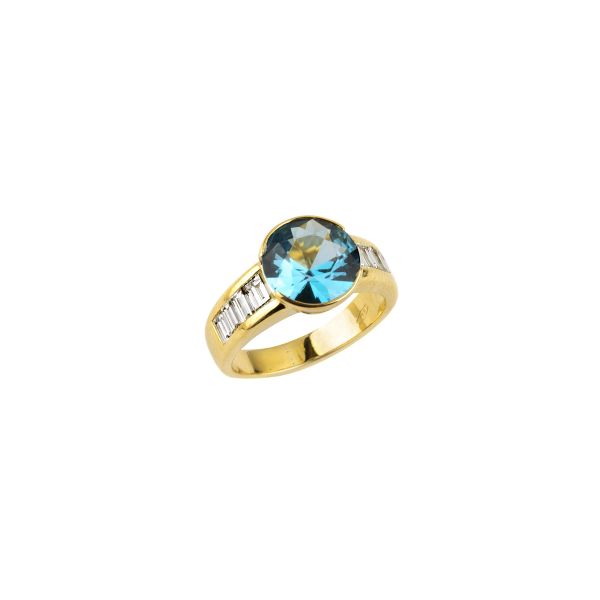 



SYNTHETIC STONE AND DIAMOND RING IN 18KT YELLOW GOLD