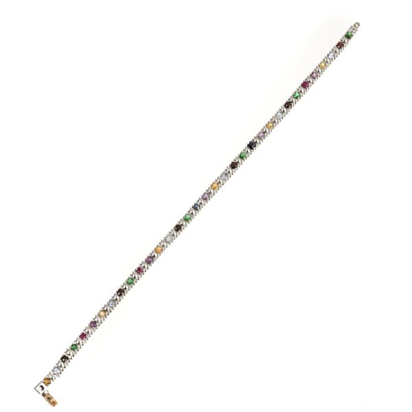 



NATURAL AND SYNTHETIC COLORED STONE TENNIS BRACELET IN 9KT WHITE GOLD