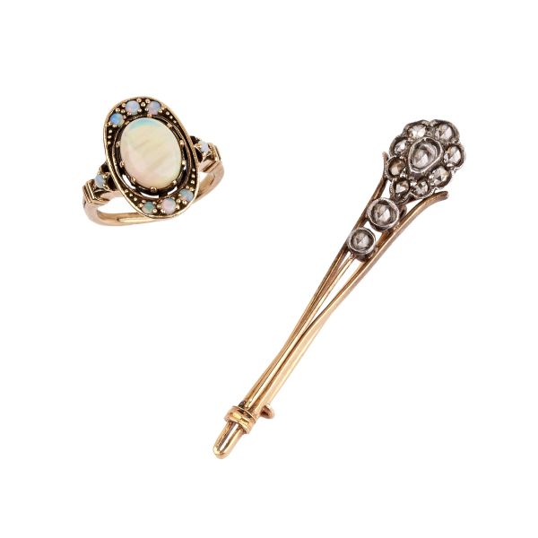 



RING AND A BARRETTE BROOCH IN GOLD AND SILVER 