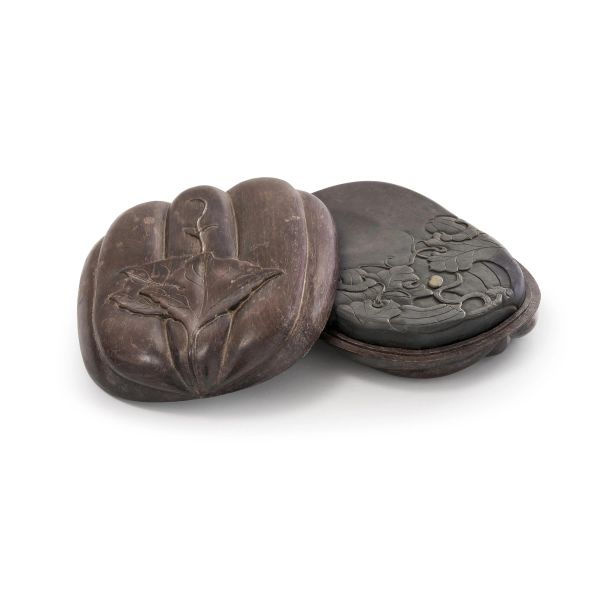 



A CARVED DUAN INKSTONE WITH WOODEN COVER, CHINA, QING DYNASTY, SEC. XIX