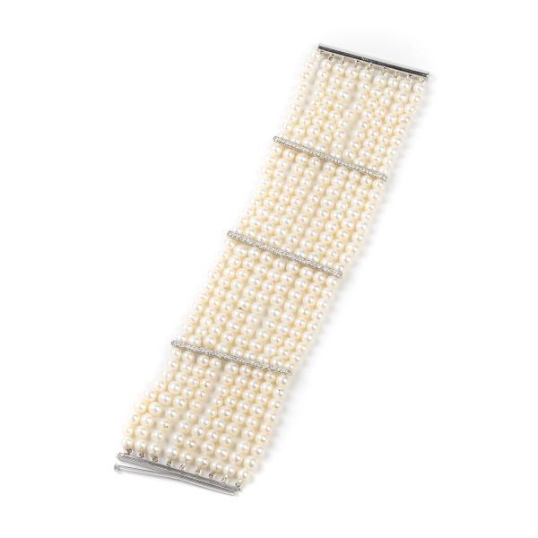 



BRACCIALE AD AMPIA FASCIA CON PERLE E DIAMANTI