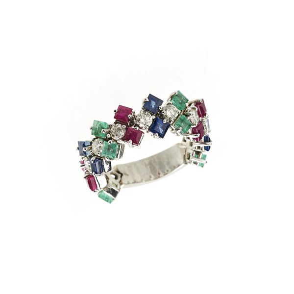 



ANELLO A FASCIA CON PIETRE DI COLORE E DIAMANTI