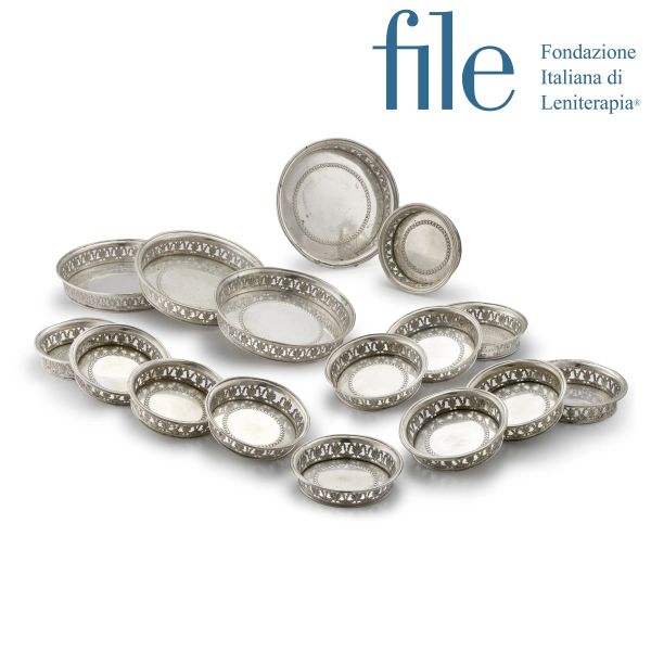 FOUR SILVER BOTTLE COASTERS AND TWELE SILVER GLASS COASTERS, MILAN, 19TH CENTURY, MARK OF PIETRO BIAZZI