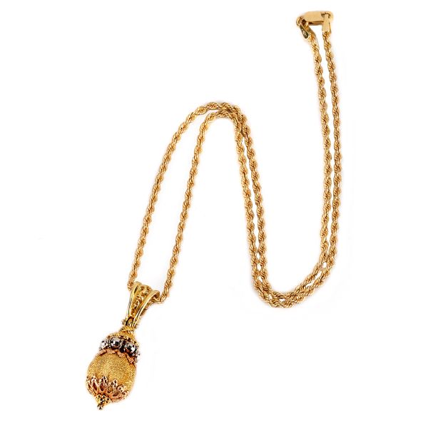 



NECKLACE WITH A CHARM IN 18KT YELLOW GOLD