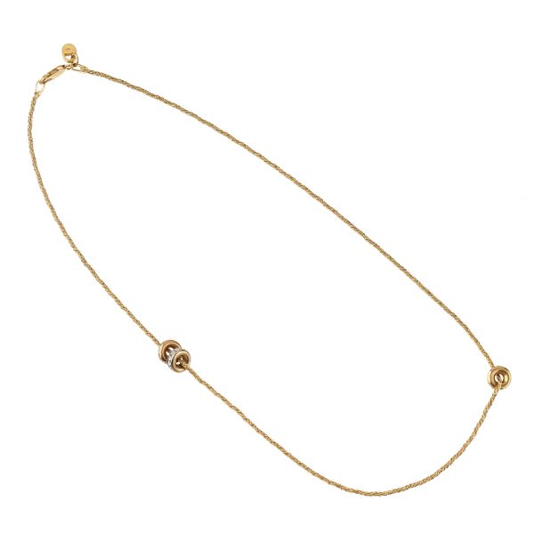 



18KT YELLOW GOLD NECKLACE WITH THREE TONE GOLD CHARMS 