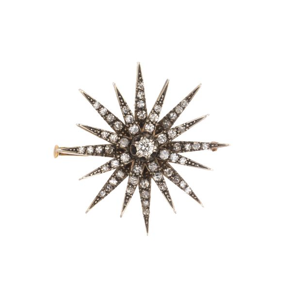 STAR-SHAPED BROOCH IN GOLD AND SILVER