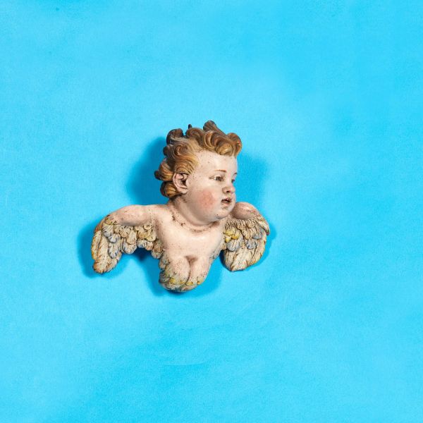 



AN HEAD OF A CHERUB, NAPLES, 18TH/19TH CENTURY