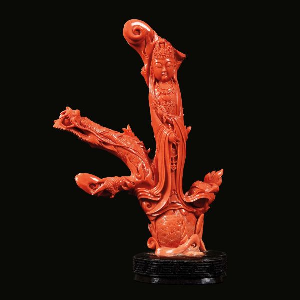 A RED CORAL FIGURE OF GUANYIN, CHINA, QING DYNASTY, 19TH CENTURY