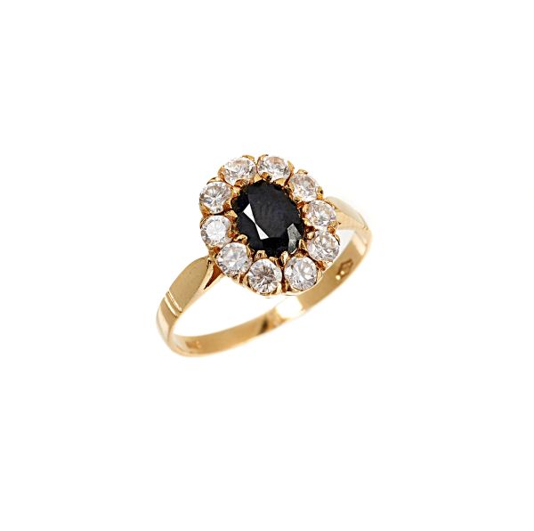 COLORLESS AND BLUE STONE RING IN 18KT YELLOW GOLD