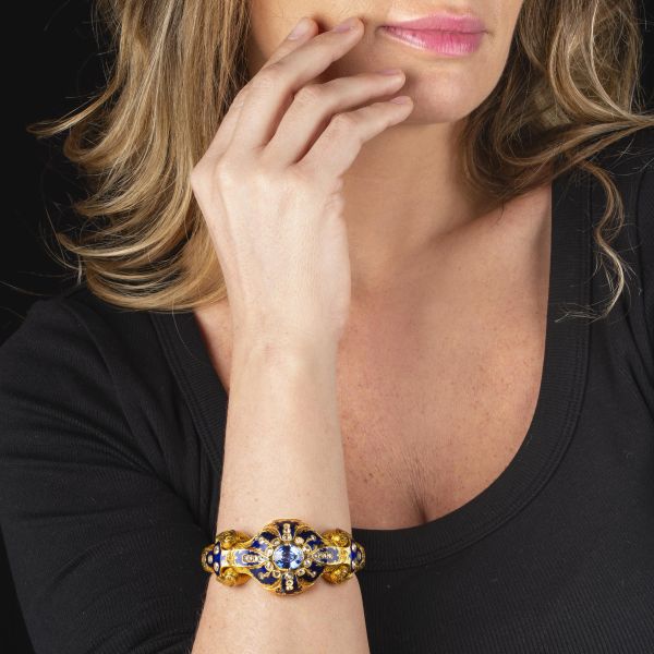 BRACCIALE RIGIDO CON OROLOGIO A SCOMPARSA