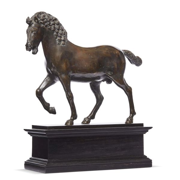 Lombardy, 16th century, A horse, patinated bronze, 22,5x27x7,5 cm, on a molded wooden base (base 9,5x10,5x23,8 cm)