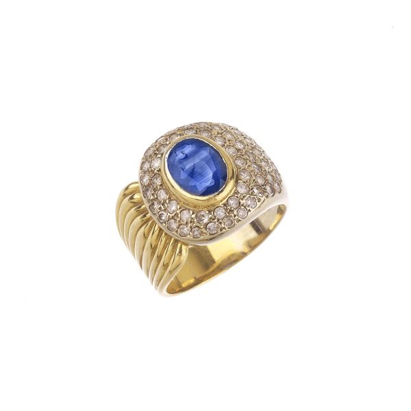 



SAPPHIRE AND DIAMOND BAND RING IN 18KT YELLOW GOLD