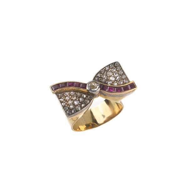 



RUBY AND DIAMOND RIBBON RING IN SILVER AND GOLD