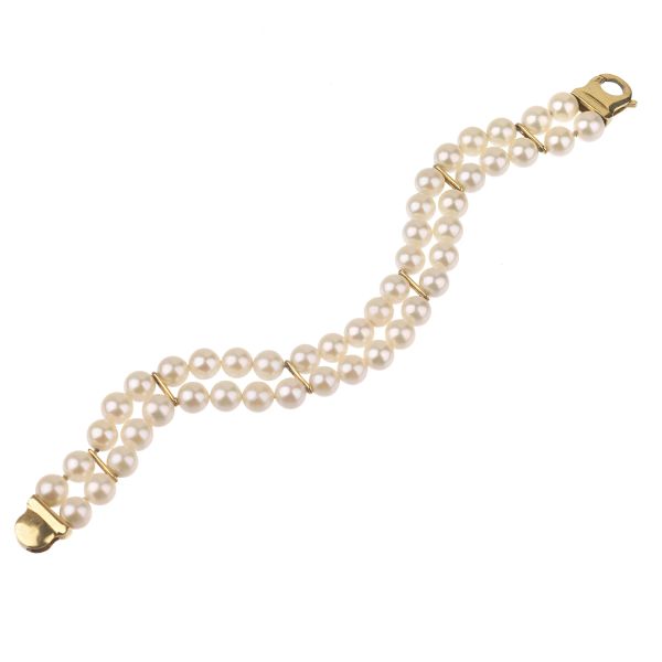 



DOUBLE STRAND PEARL BRACELET IN 18KT YELLOW GOLD