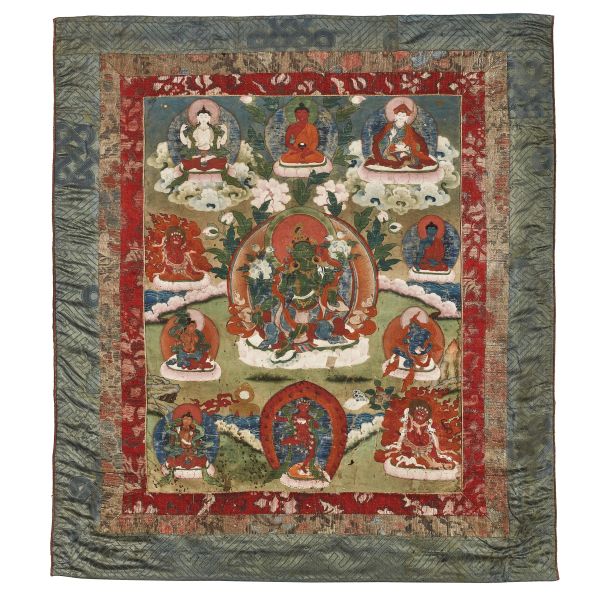 A TANGKA ON PAPER APPLIED TO FABRIC, DEPICTING ELEVEN BUDDHIST FIGURES, TIBET, SEC. XIX