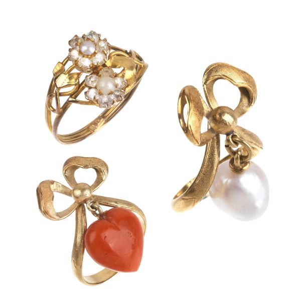THREE CORAL AND PEARL RINGS IN GOLD
