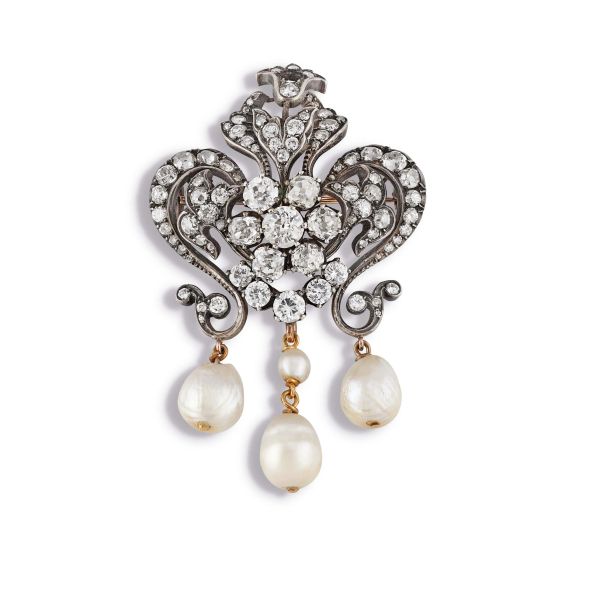 



DIAMOND AND PEARL BROOCH IN 9KT GOLD AND SILVER