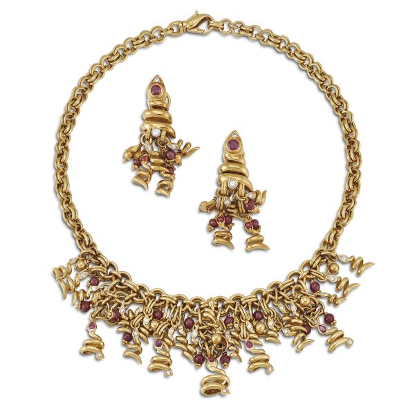 SNAKES-SHAPED RUBY AND DIAMOND DEMI PARURE IN 18KT YELLOW GOLD
