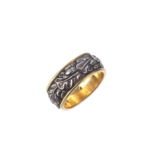 



BAND RING IN 18KT YELLOW GOLD AND METAL