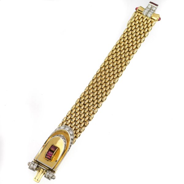 



RUBY AND DIAMOND BRACELET IN 18KT TWO TONE GOLD WITH A HIDDEN WATCH