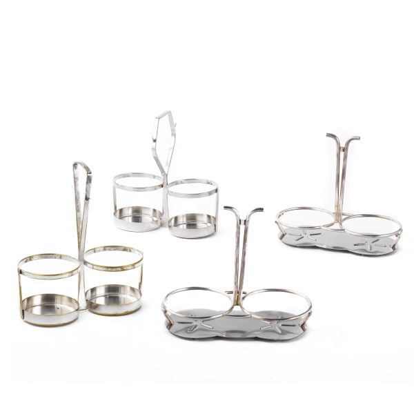 A SILVER METAL STAND AND FOUR BASES FOR OIL POT
