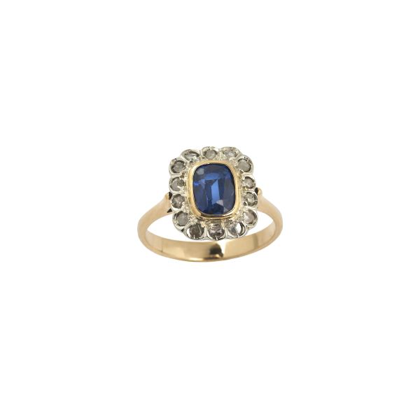 



SYNTHETIC SAPPHIRE AND DIAMOND RING IN 18KT TWO TONE GOLD