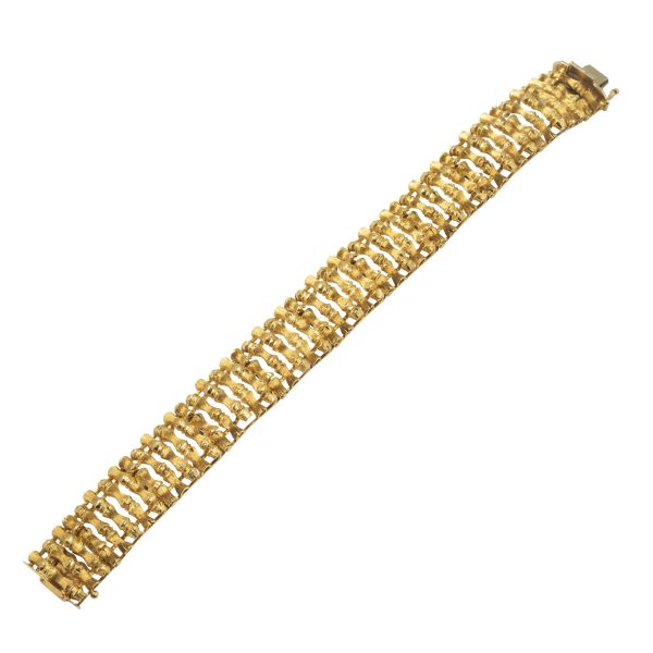 



BRACCIALE A MAGLIE LARGHE 