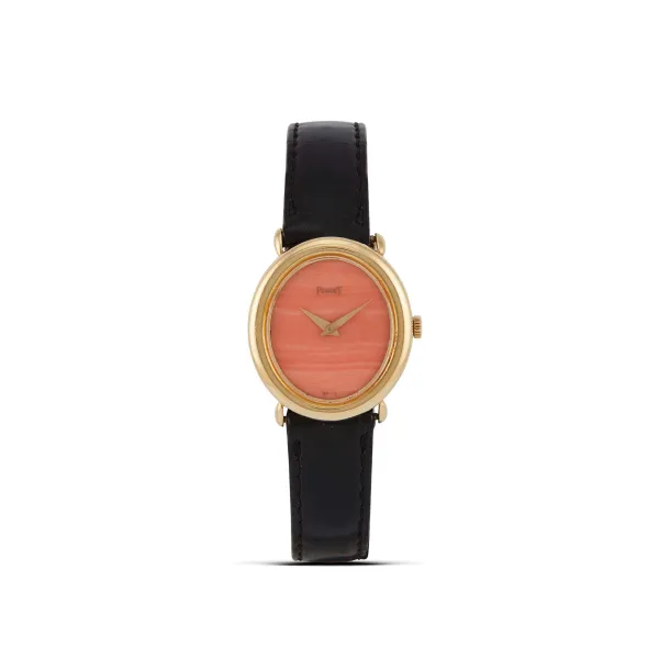 Piaget - 



PIAGET LADY REF. 9812 CORAL DIAL YELLOW GOLD WRISTWATCH
