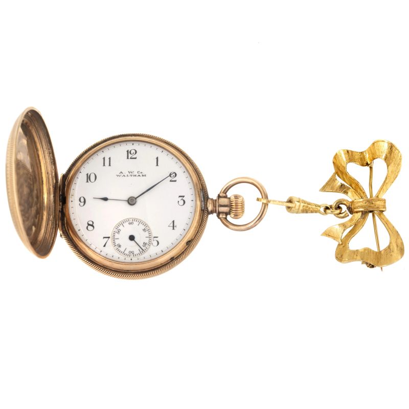 



WALTHAM LOW TITLE GOLD POCKET WATCH WITH A BOW BROOCH  - Auction WATCHES - Pandolfini Casa d'Aste