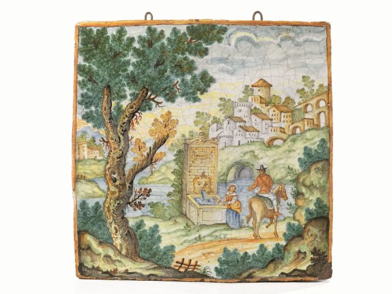 Grande placca, Castelli, inizi sec. XIX, raffigurante scena con viandante in un paesaggio alberato con fontana, cm 49,5x49,5x5  - Asta Mobili, Arredi e Oggetti d'Arte - Pandolfini Casa d'Aste