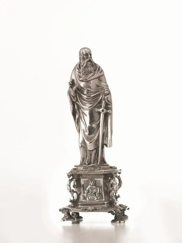 Statuina, inizi sec. XIX, in argento raffigurante San Paolo su plinto poggiante su quattro piedini modellati ad animali alati, alt. cm 20,5, g 375  - Auction Silver and Coins - II - Pandolfini Casa d'Aste