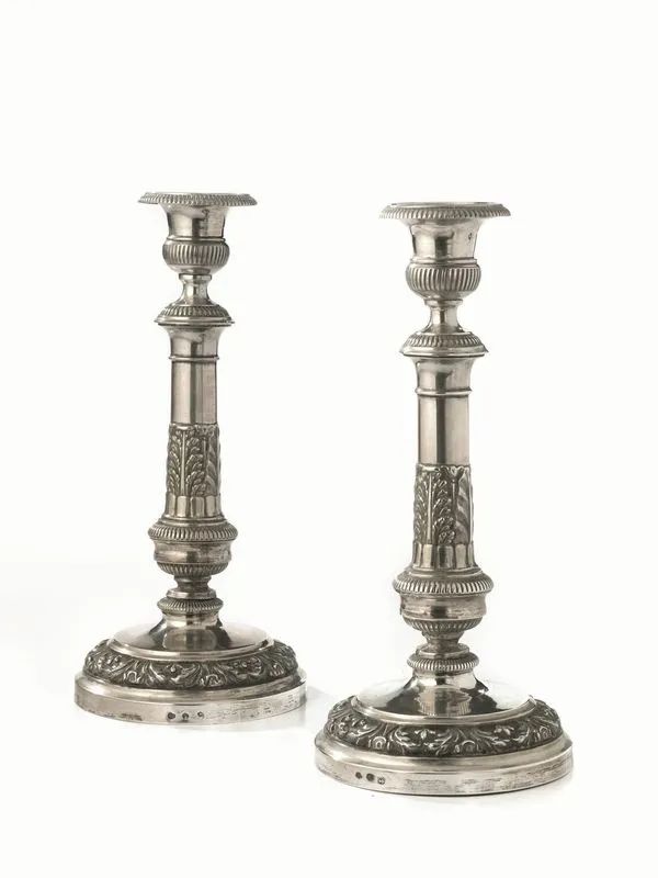 Coppia di candelieri, Torino, facitore Giuseppe Lanza, met&agrave; sec. XIX, in argento, base circolare decorata da tralcio fogliaceo, fusto a colonna con elementi vegetali cesellati, alt. cm 30, g 765 (2)  - Auction Silver and Coins - II - Pandolfini Casa d'Aste