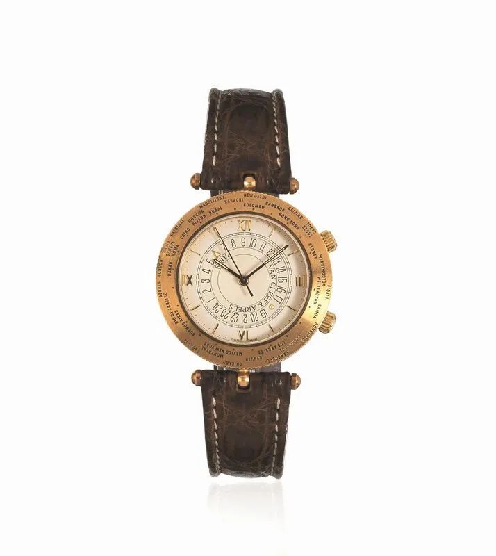 OROLOGIO DA POLSO CON ORE DEL MONDO E ALLARME VAN CLEEF AND ARPELS TRAVELER REF. 123038 44828, CASSA N. 54, IN ORO GIALLO 18 K, ANNI &lsquo;90  - Auction WATCHES - Pandolfini Casa d'Aste