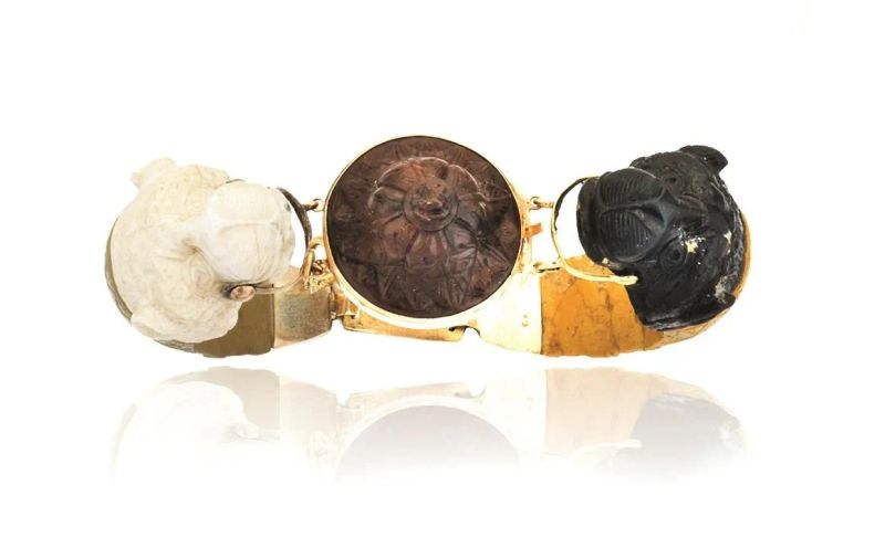 BRACCIALE IN ORO A BASSO TITOLO E PIETRA LAVICA  - Auction FINE JEWELS AND WATCHES - Pandolfini Casa d'Aste